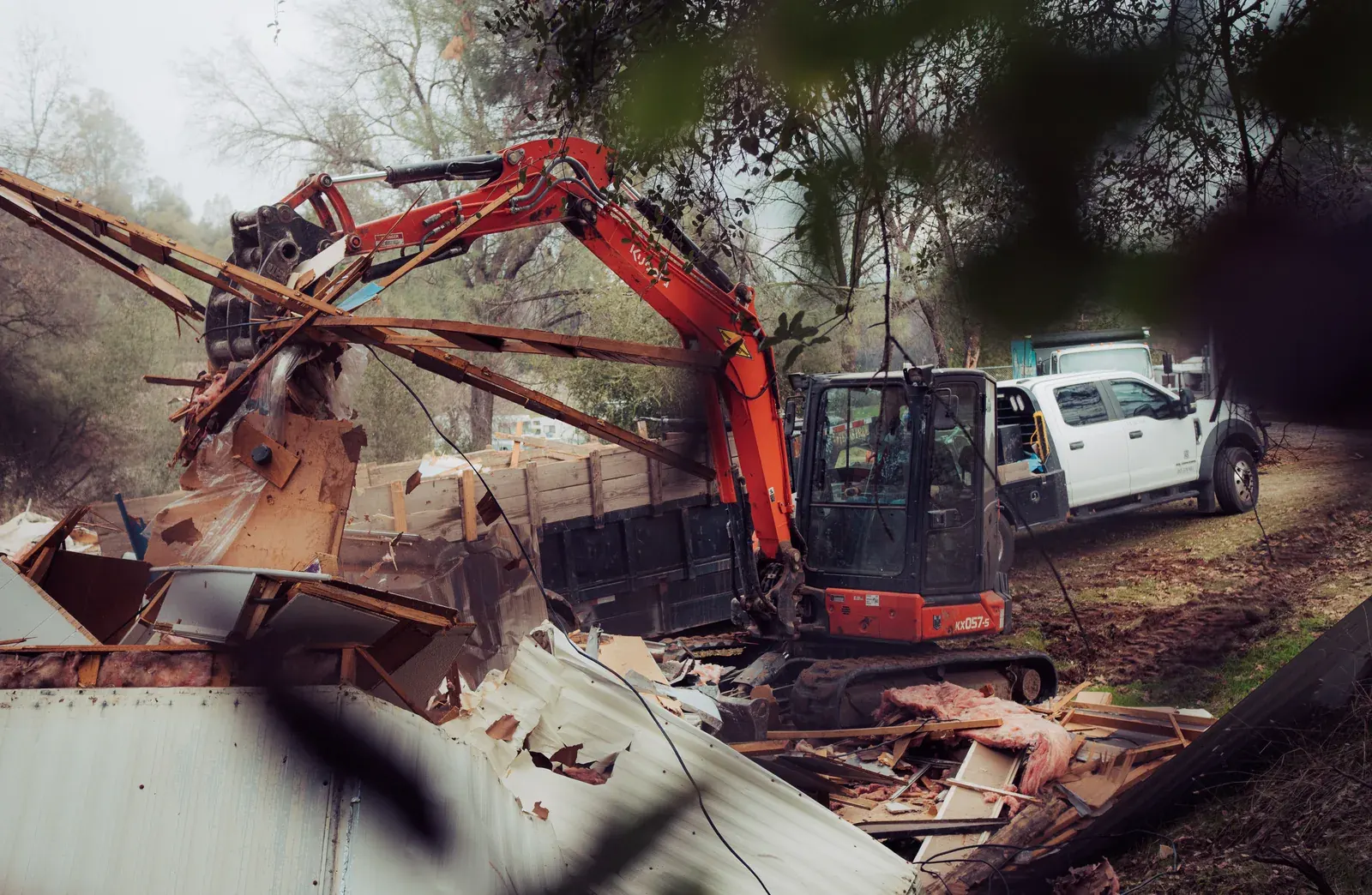 Kubota excavator tearing down a mobile home at a Northern California mobile home park